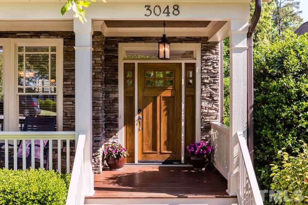 3048 Farrior Road Raleigh, NC 27607 - Photo 2 of 25 a front view of a building with flowers