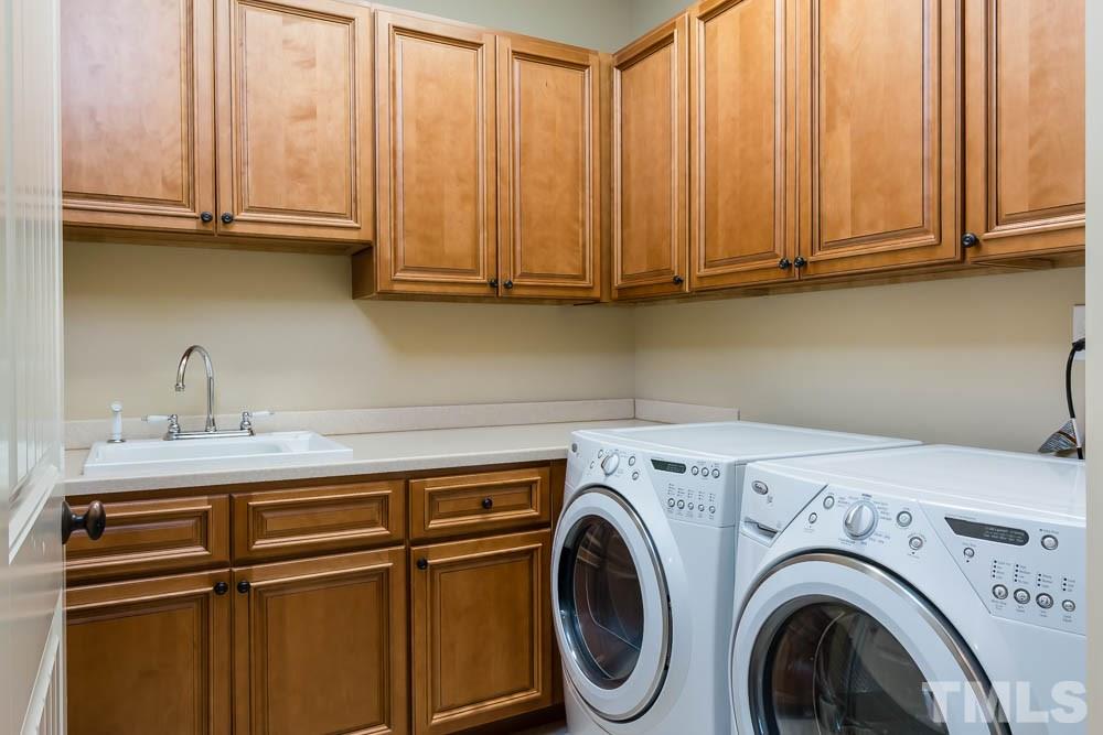 3048 Farrior Road Raleigh, NC 27607 - Photo 14 of 25 a utility room with dryer and washer