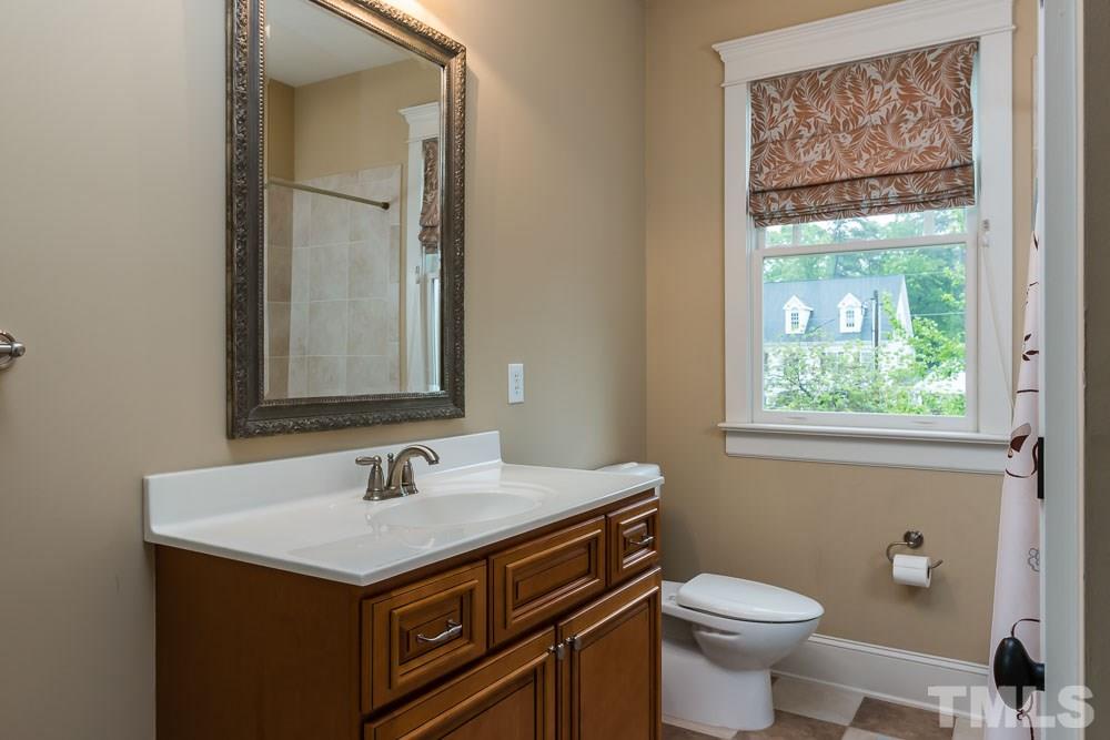 3048 Farrior Road Raleigh, NC 27607 - Photo 16 of 25 a bathroom with a sink and a toilet
