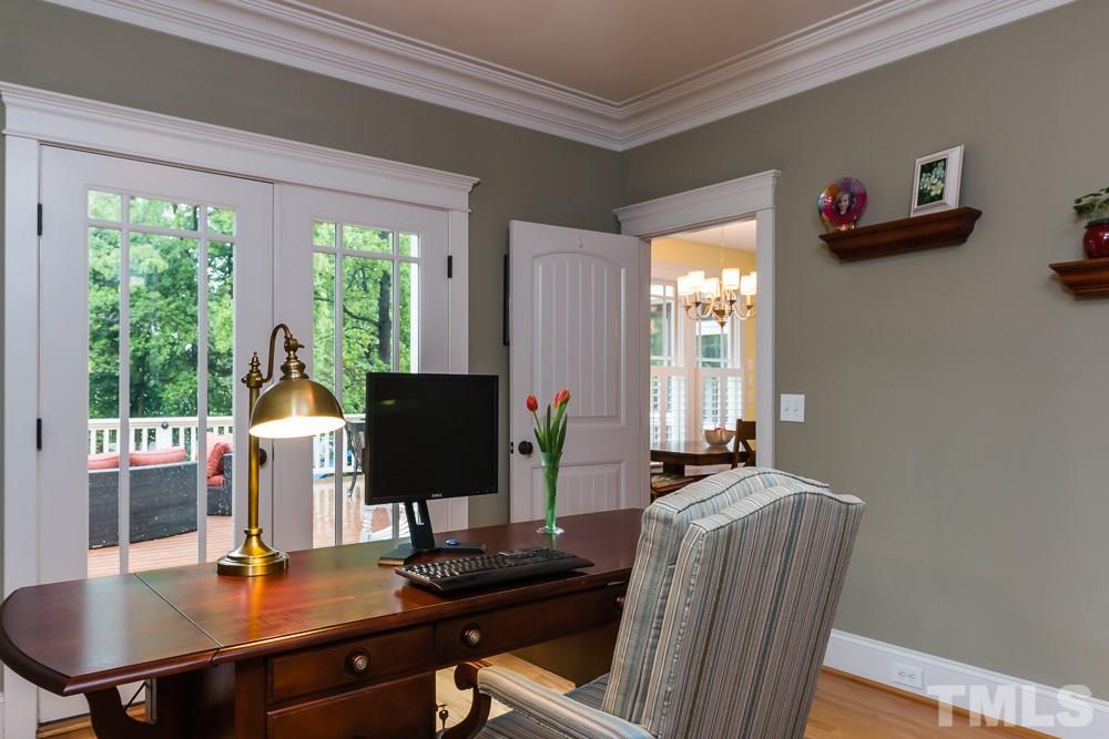 3048 Farrior Road Raleigh, NC 27607 - Photo 10 of 25 a work room with furniture and wooden floor