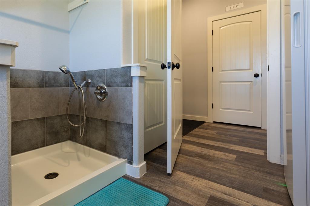 14910 Old Stoney Road Ponder, TX 76259 - Photo 32 of 36 a bathroom with a tub and sink