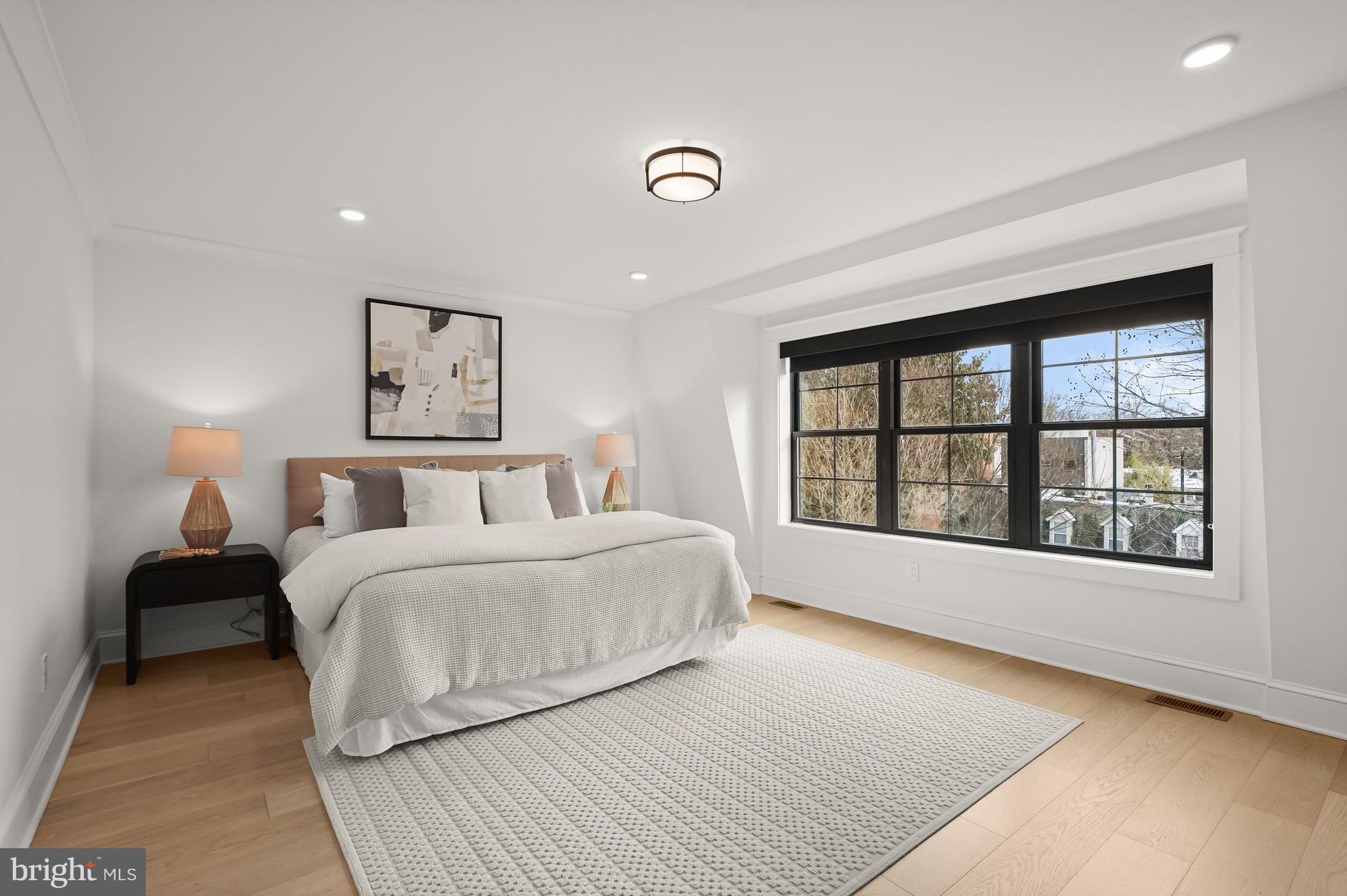 3719 R Street Northwest Washington, DC 20007 - Photo 13 of 44 a spacious bedroom with a large bed and a window