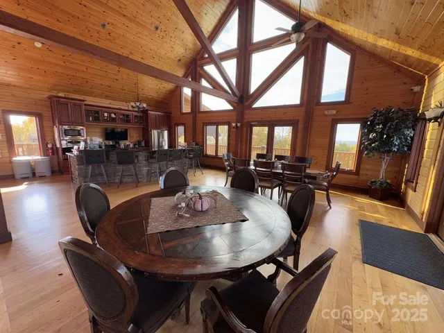 a room with wooden floors and pool table