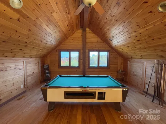 a room with gym equipment and large mirror