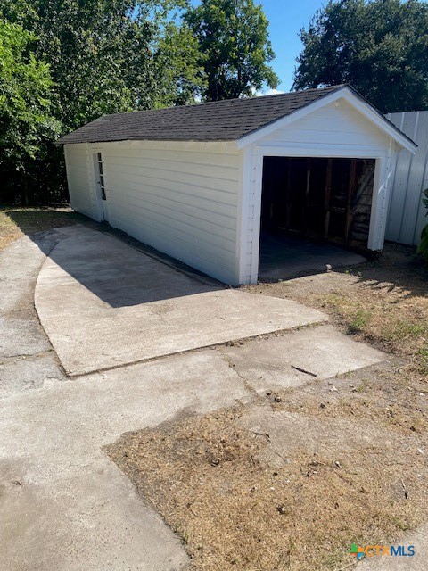 2405 Lone Tree Road Victoria, TX 77901 - Photo 13 of 13 a view of backyard with potted plants and a large tree