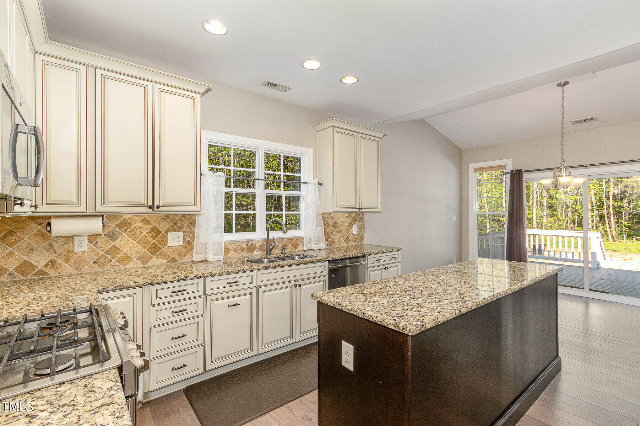 3640 Pineview Circle Durham, NC 27705 - Photo 11 of 41 a kitchen with granite countertop sink and cabinets