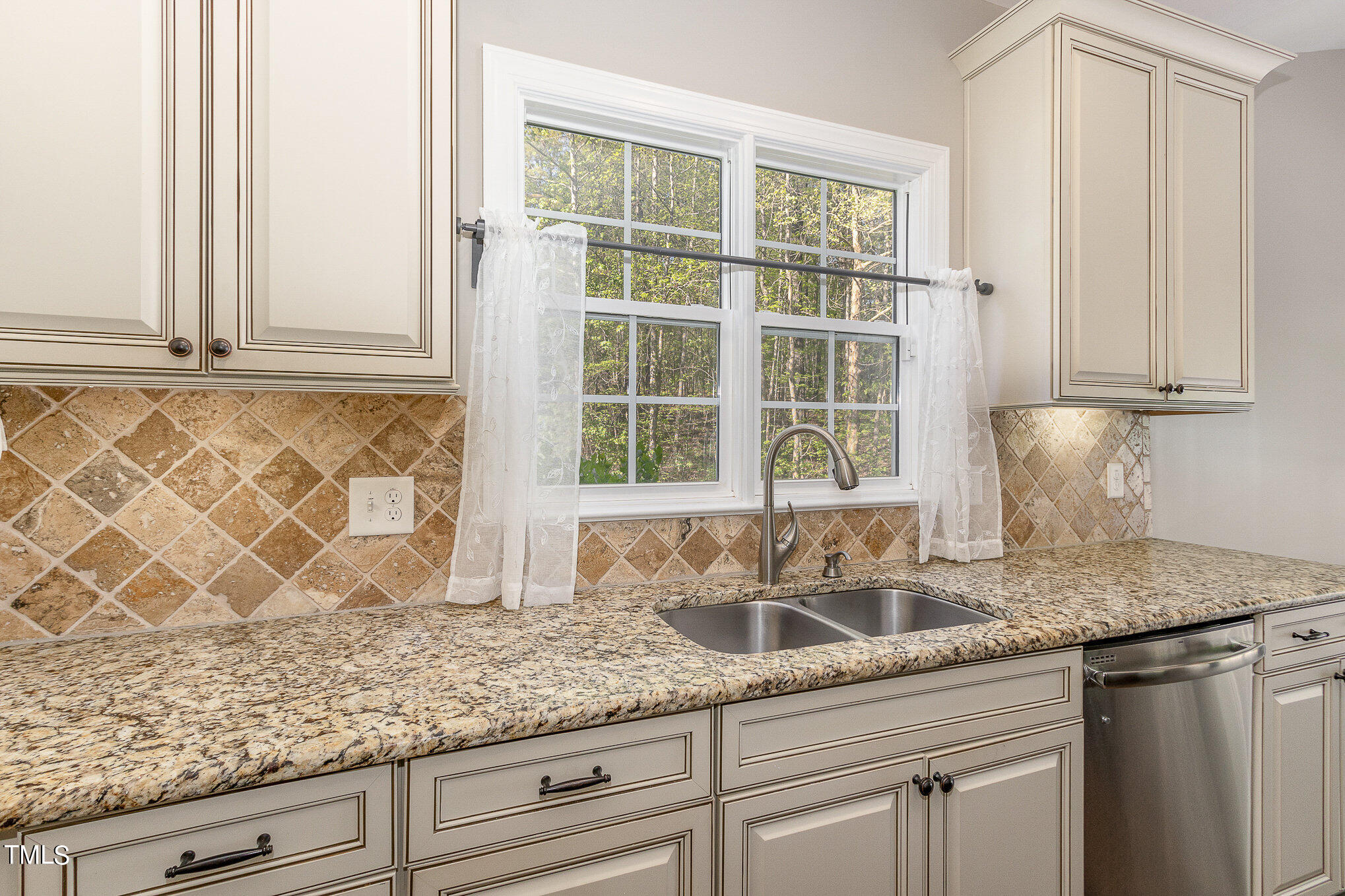 3640 Pineview Circle Durham, NC 27705 - Photo 14 of 41 a kitchen with granite countertop cabinets and window