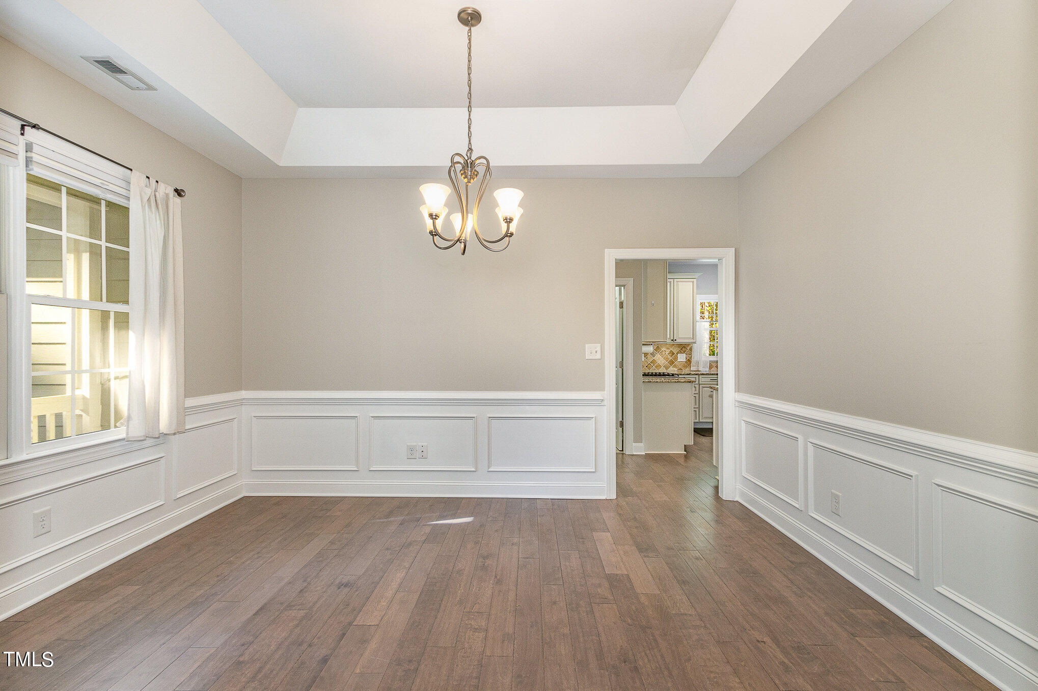 3640 Pineview Circle Durham, NC 27705 - Photo 18 of 41 a view of empty room with wooden floor and window