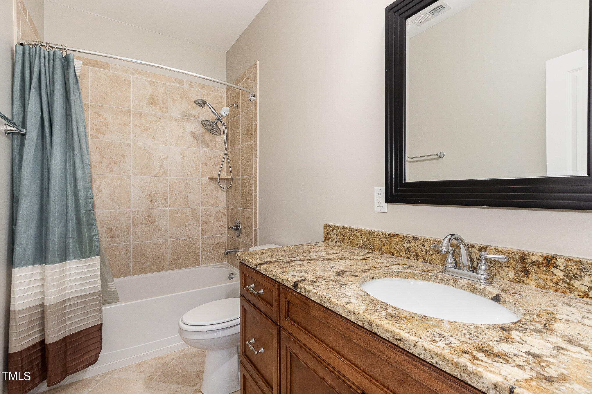 3640 Pineview Circle Durham, NC 27705 - Photo 20 of 41 a bathroom with a granite countertop sink toilet mirror and shower