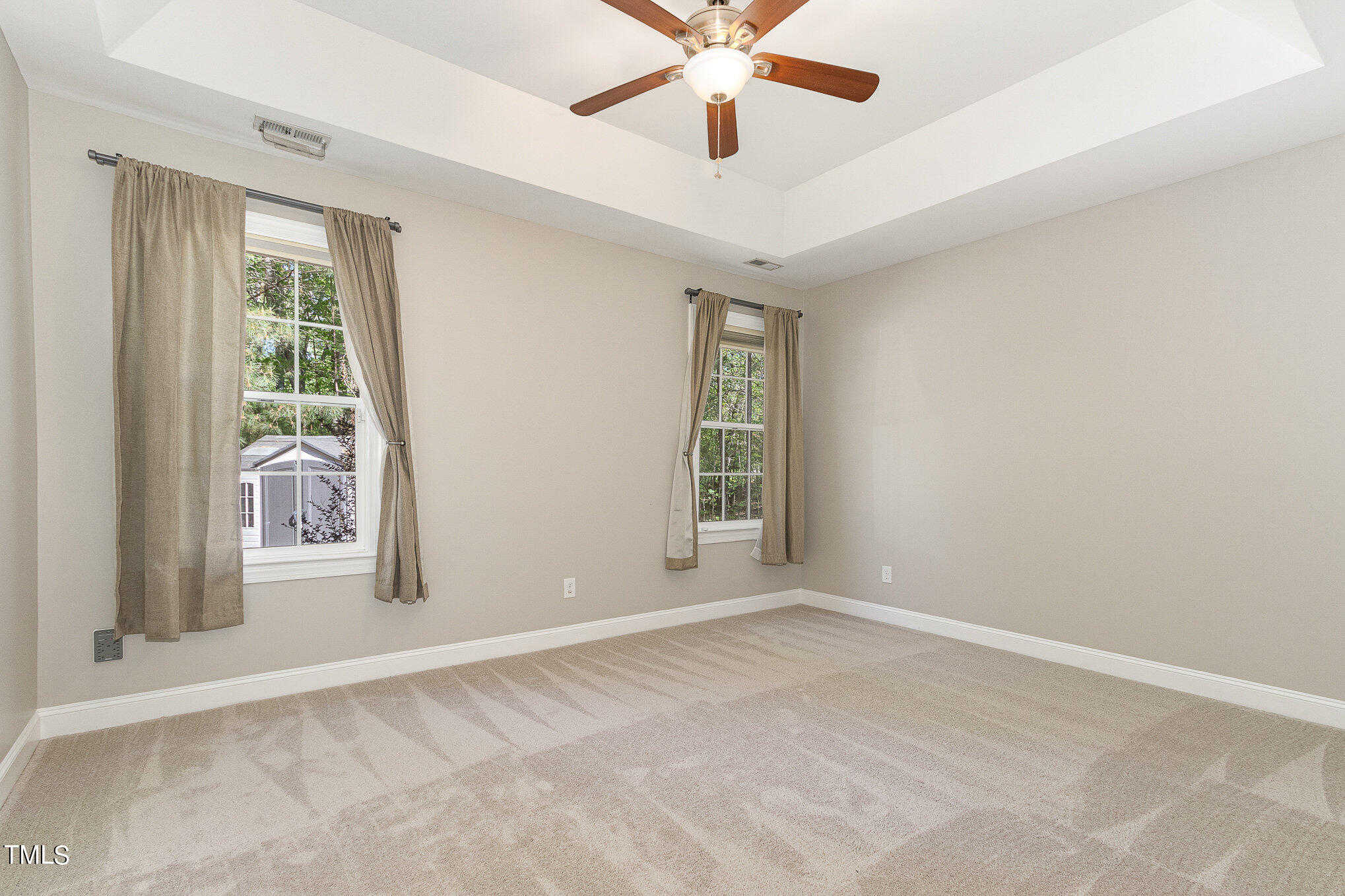 3640 Pineview Circle Durham, NC 27705 - Photo 23 of 41 an empty room with windows and fan