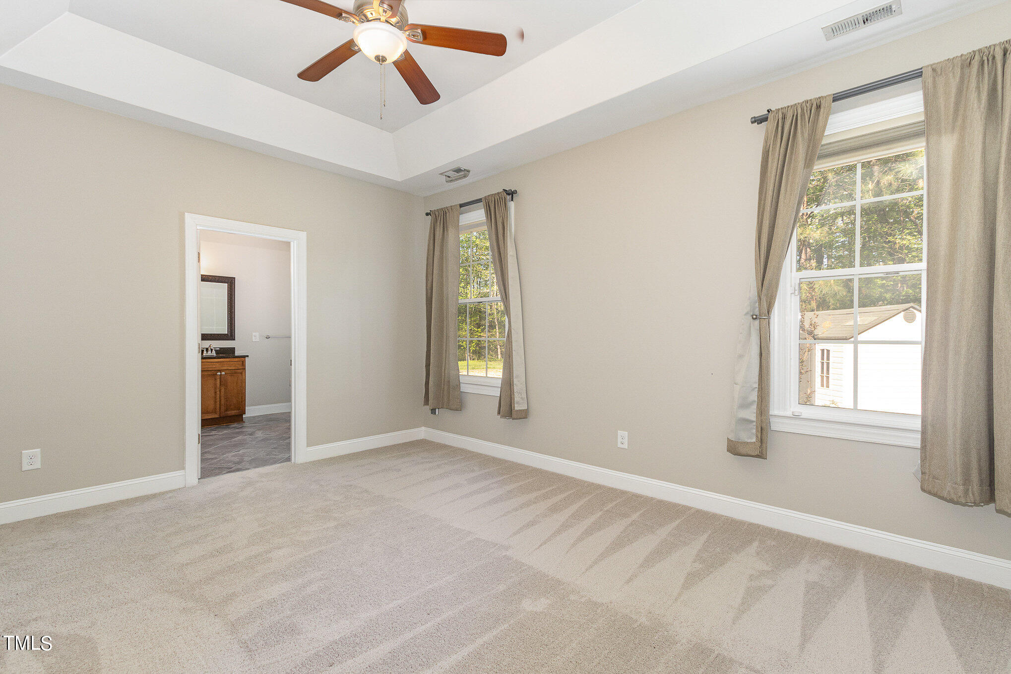 3640 Pineview Circle Durham, NC 27705 - Photo 24 of 41 an empty room with chandelier fan and windows