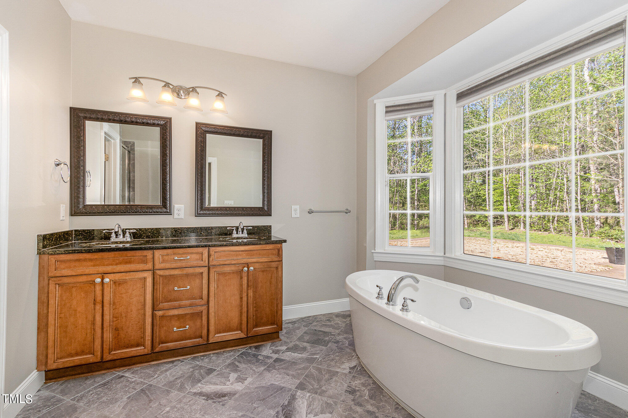 3640 Pineview Circle Durham, NC 27705 - Photo 26 of 41 a bathroom with a bathtub sink and mirror
