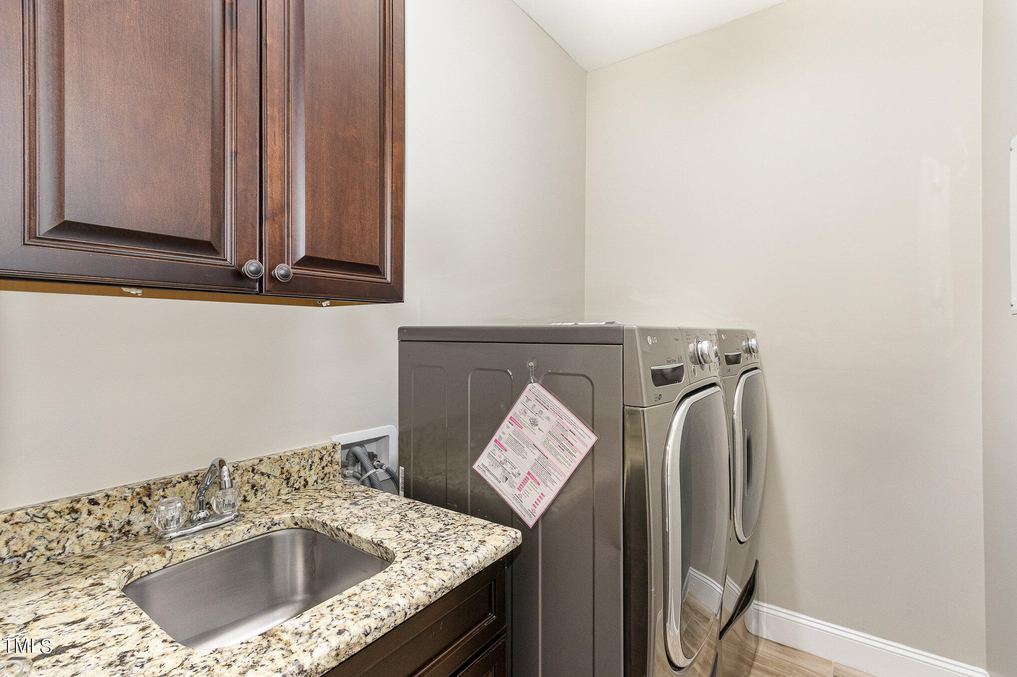 3640 Pineview Circle Durham, NC 27705 - Photo 33 of 41 a bathroom with a granite countertop sink and a mirror