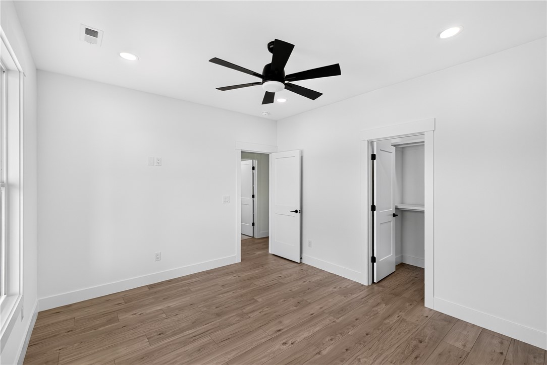 424 Blume Road Anderson, SC 29625 - Photo 23 of 30 Well-lit room with wood flooring features a contemporary ceiling fan and ample closet space.