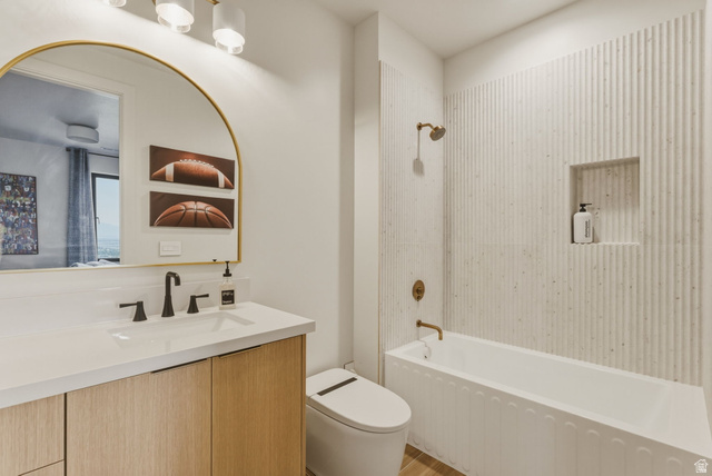 923 North Emery Lane Elk Ridge, UT 84651 - Photo 49 of 101 Contemporary bathroom featuring a wood-finish vanity with a white countertop and rectangular undermount sink