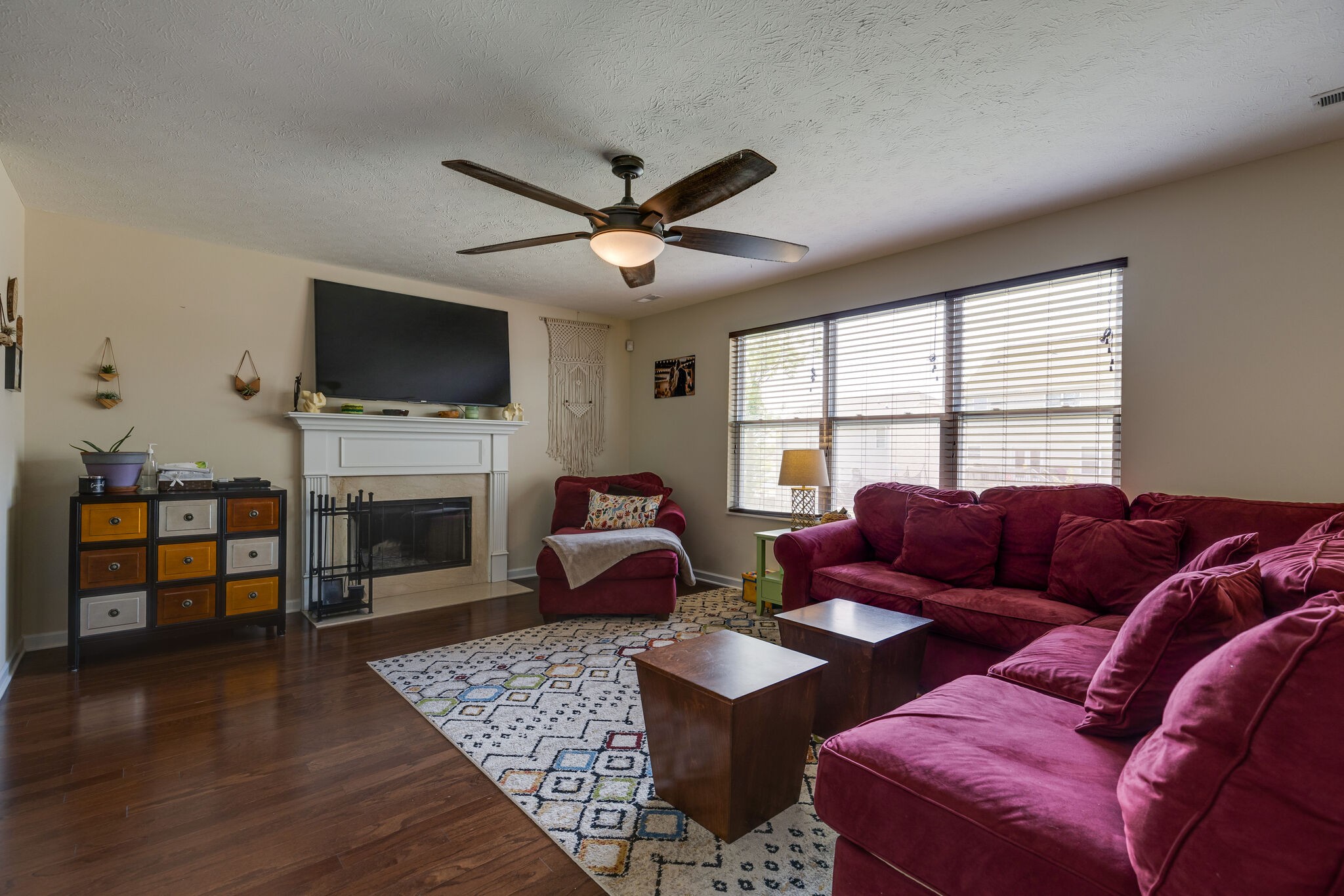 4757 Backstretch Boulevard Antioch, TN 37013 - Photo 11 of 39 a living room with furniture a flat screen tv and a fireplace