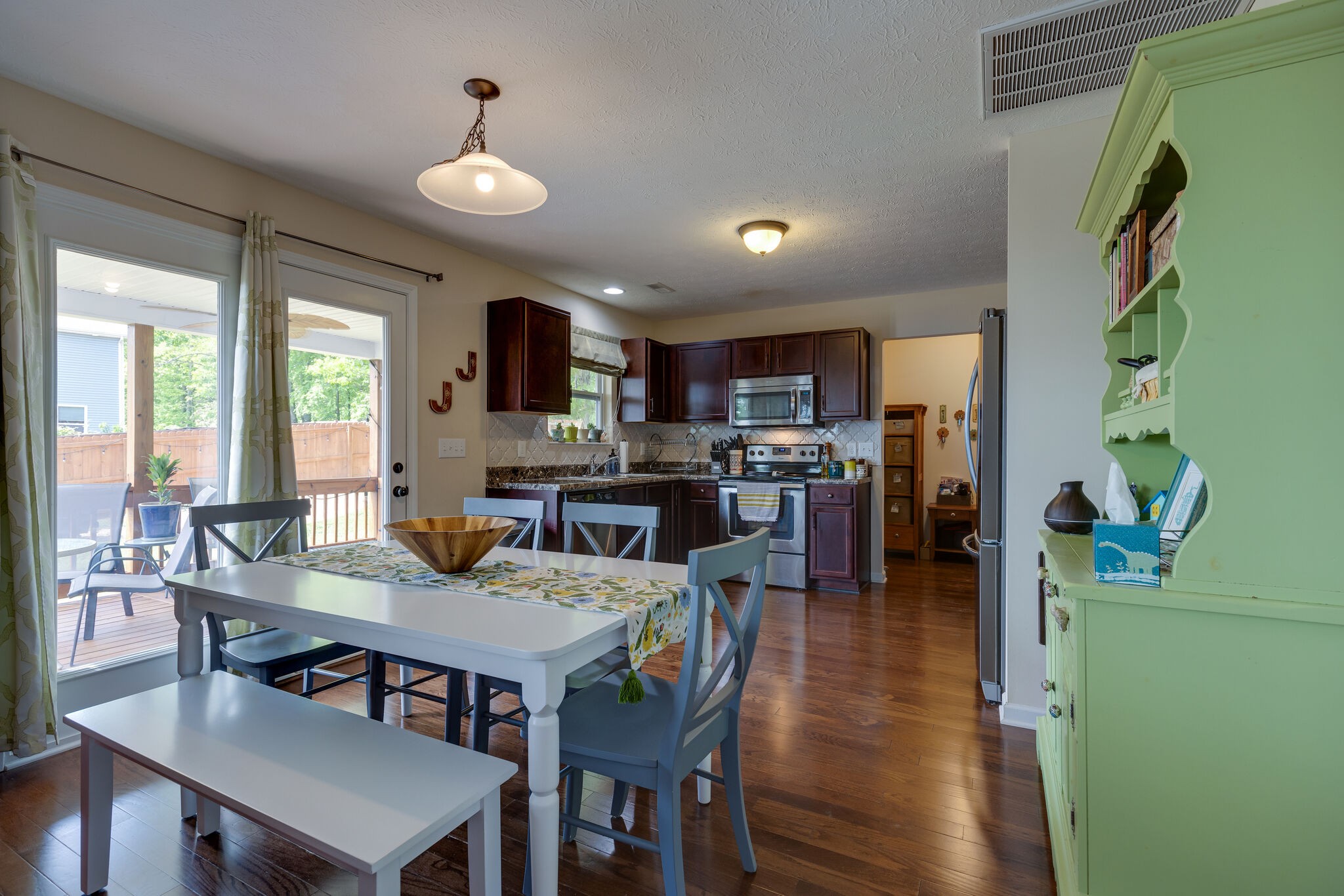 4757 Backstretch Boulevard Antioch, TN 37013 - Photo 12 of 39 a view of a dining room with furniture and wooden floor
