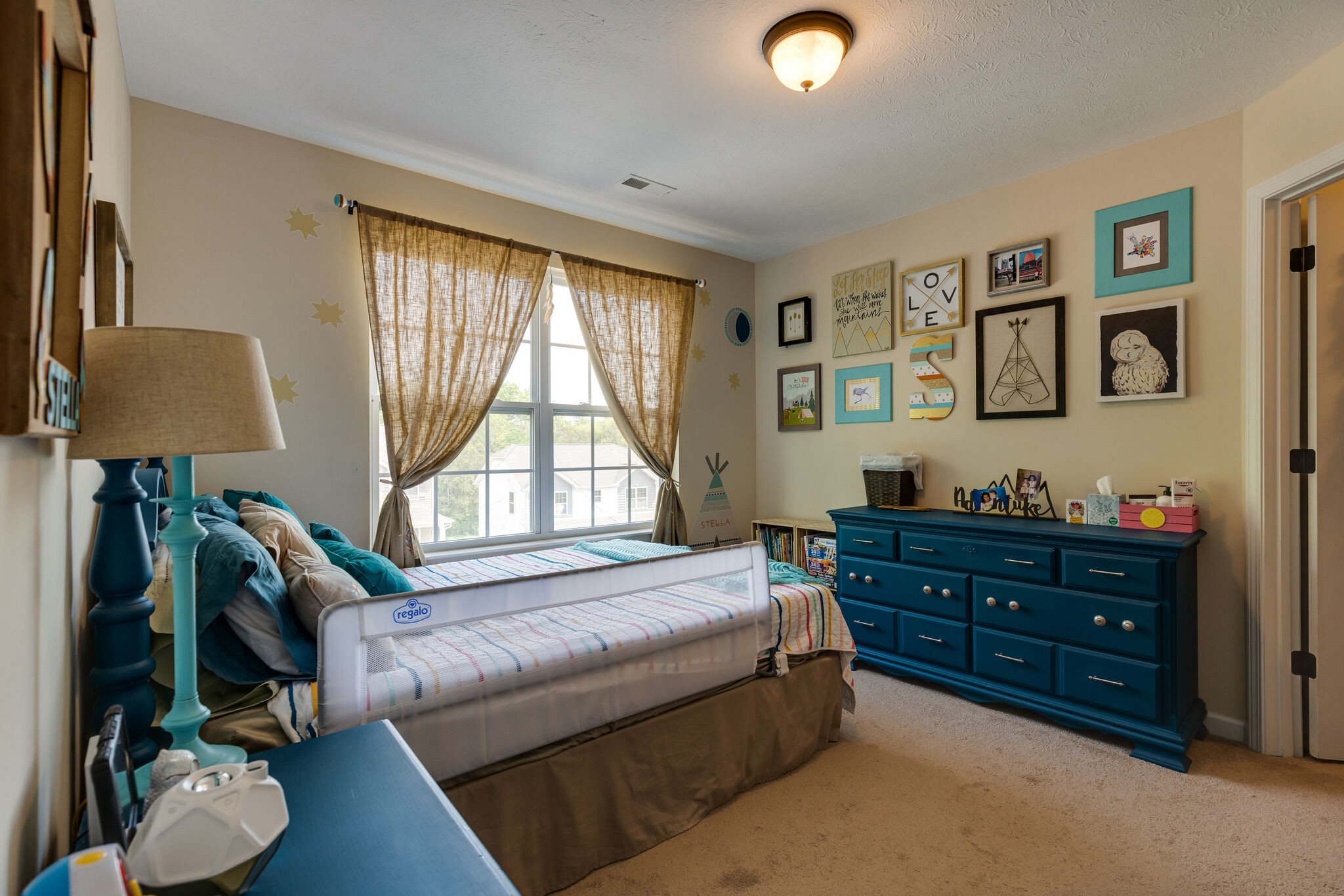 4757 Backstretch Boulevard Antioch, TN 37013 - Photo 17 of 39 a bedroom with furniture and a window