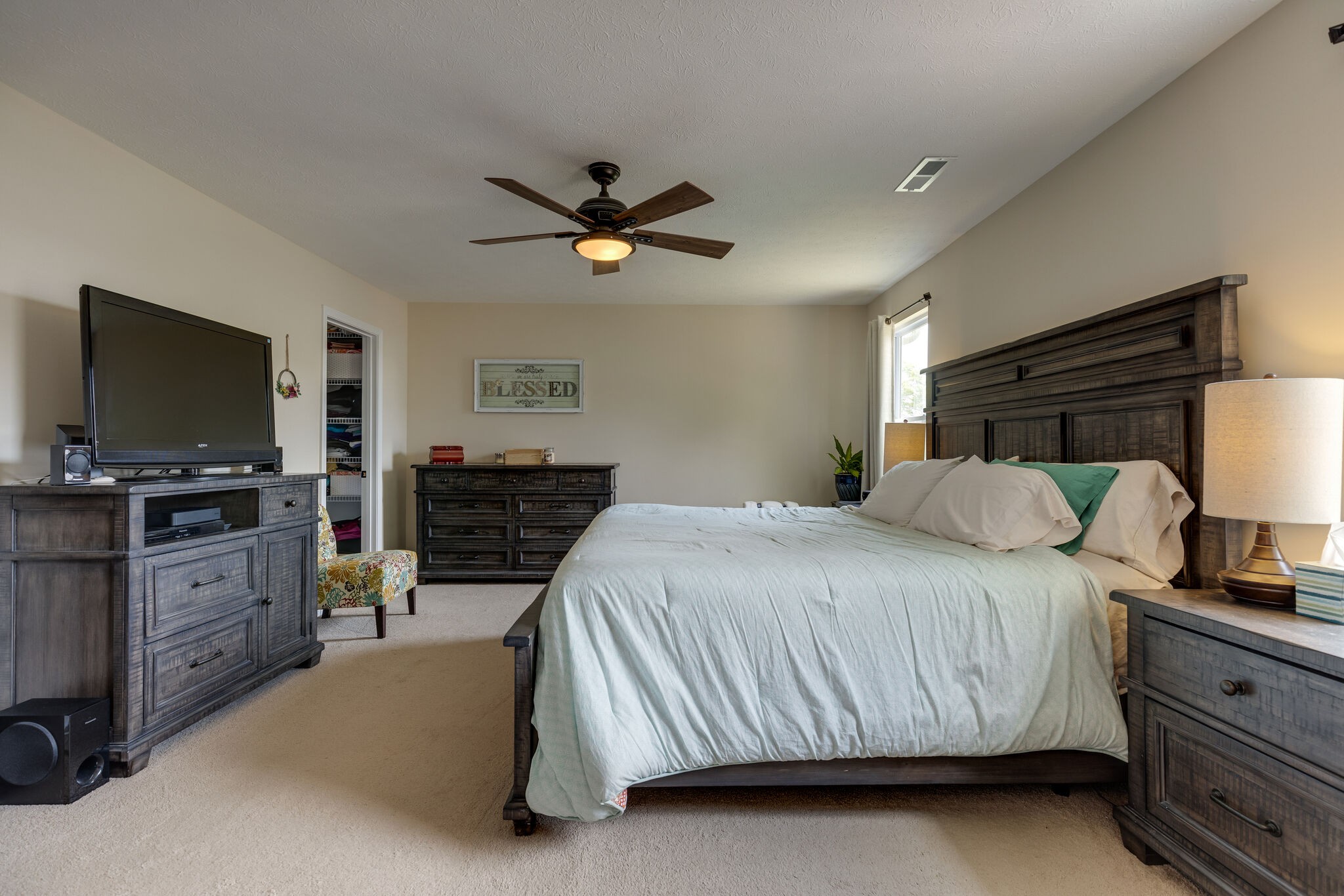 4757 Backstretch Boulevard Antioch, TN 37013 - Photo 28 of 39 a bedroom with a bed and a flat screen tv