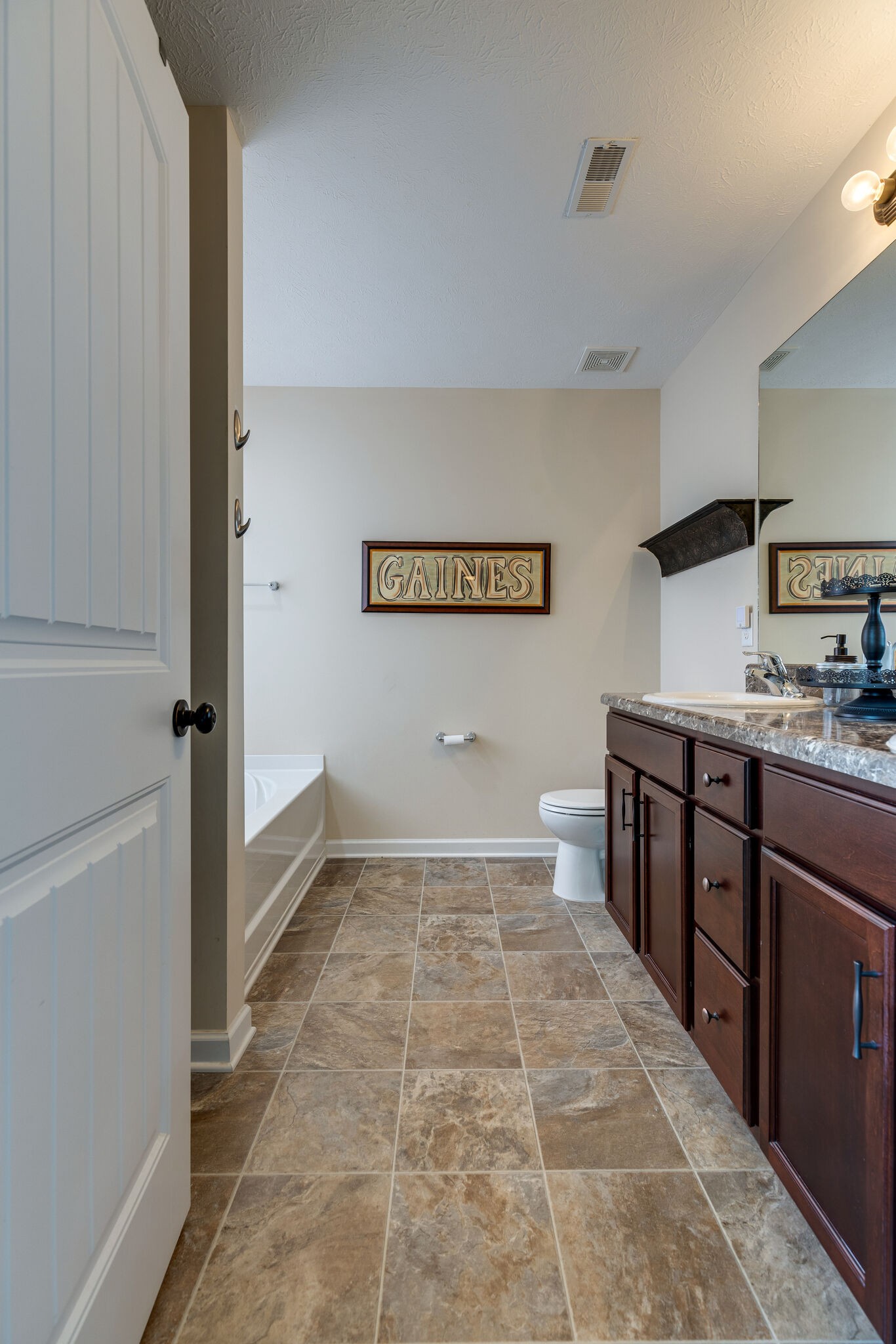 4757 Backstretch Boulevard Antioch, TN 37013 - Photo 29 of 39 a bathroom with a sink a toilet and mirror