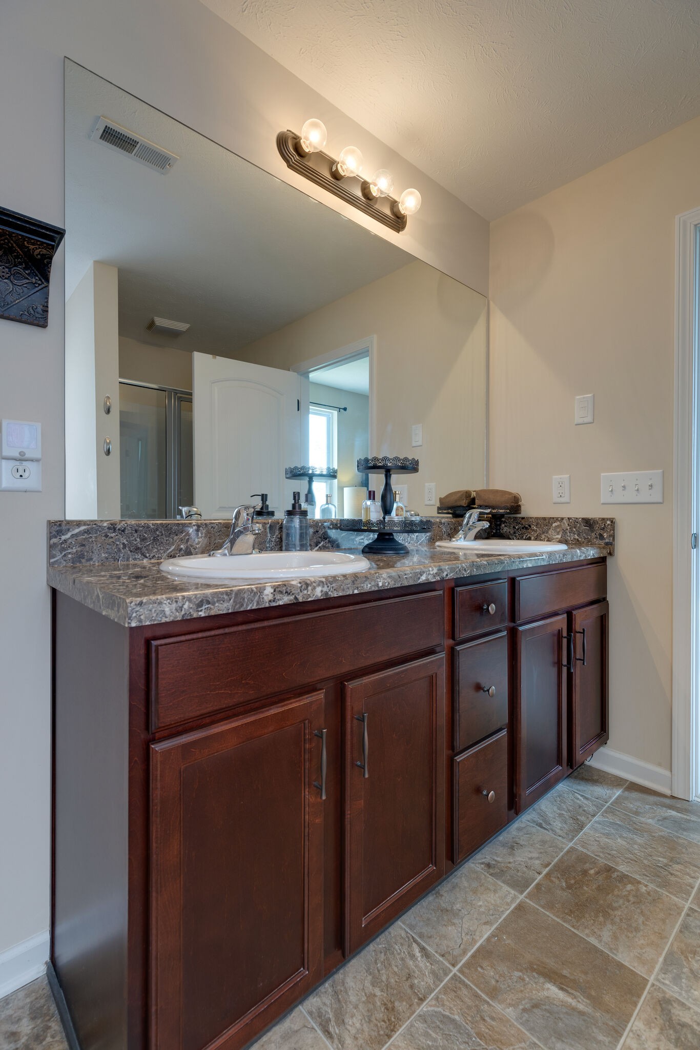 4757 Backstretch Boulevard Antioch, TN 37013 - Photo 30 of 39 a bathroom with a granite countertop sink and a mirror