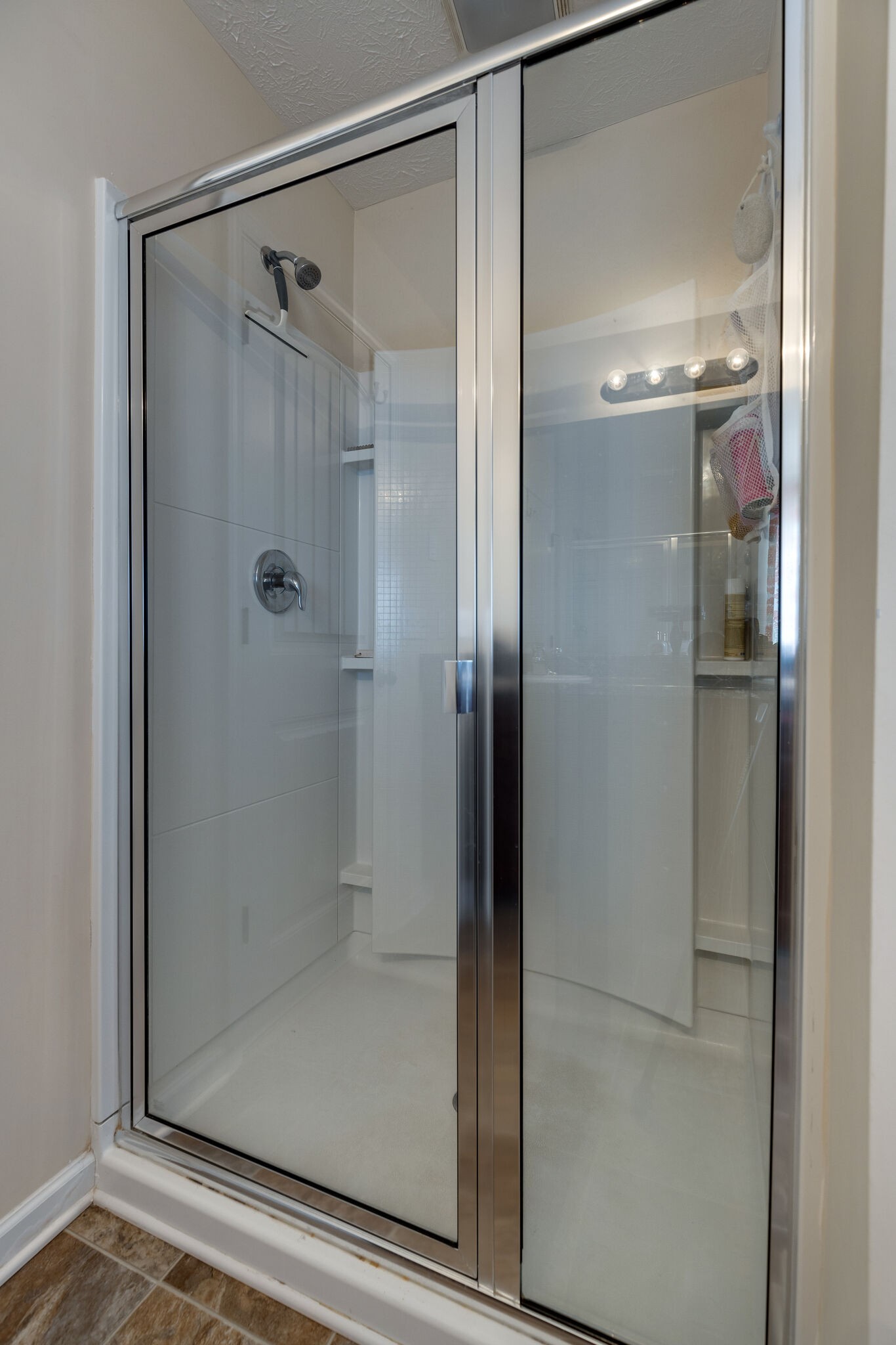 4757 Backstretch Boulevard Antioch, TN 37013 - Photo 32 of 39 a bathroom with a glass shower door