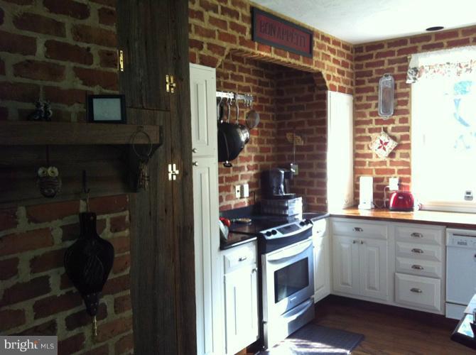 4523 Pleasant Grove Road Reisterstown, MD 21136 - Photo 12 of 23 brick wall & FP in kit/family room