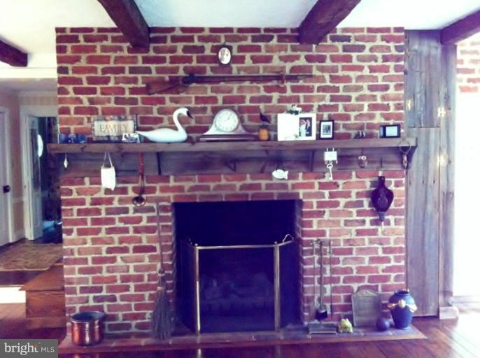 4523 Pleasant Grove Road Reisterstown, MD 21136 - Photo 17 of 23 brick FP in family room adjoining kitchen