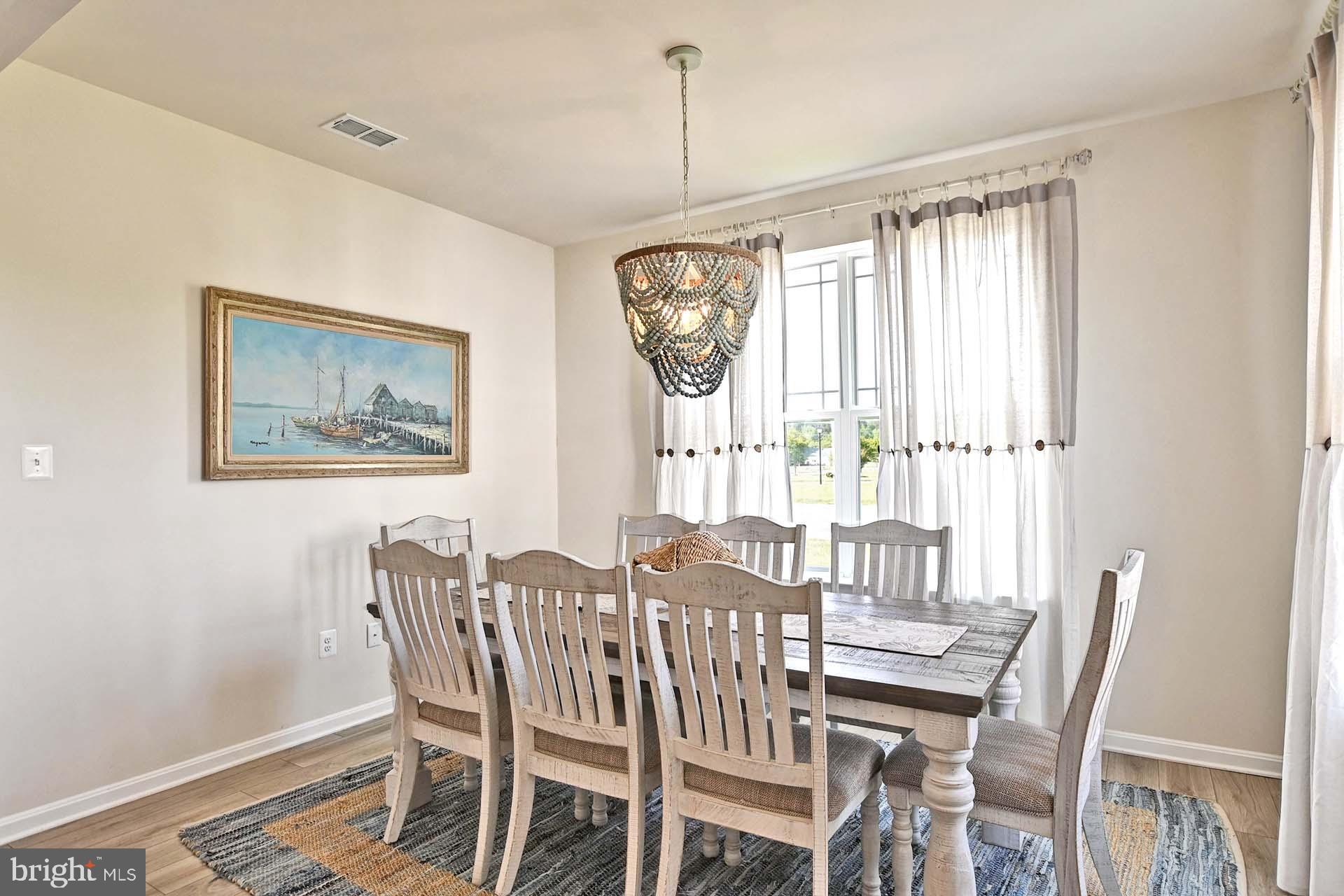 6 Basin Cove Way Ocean View, DE 19970 - Photo 12 of 45 a dining room with furniture and window