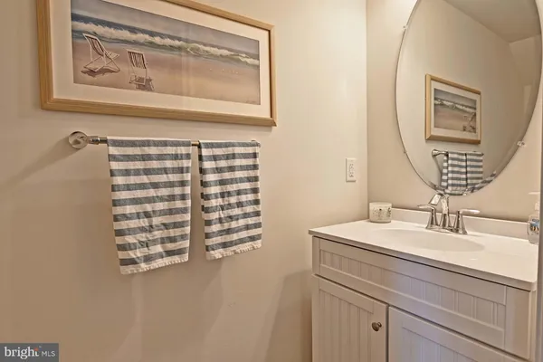 a bathroom with a sink a vanity and a mirror