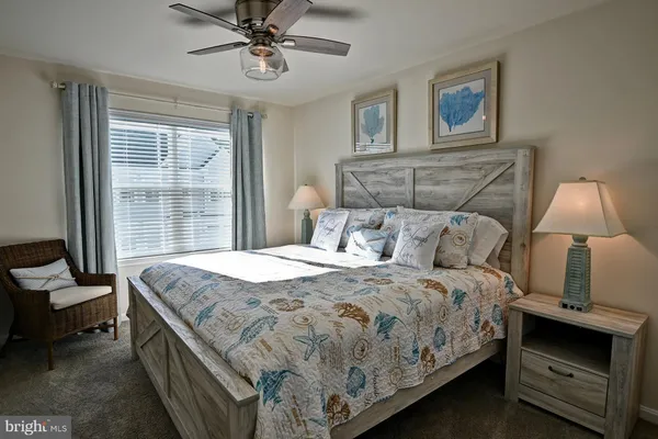 a bathroom with a toilet a sink and a mirror