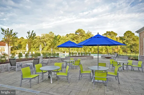 a room with furniture pool table and windows