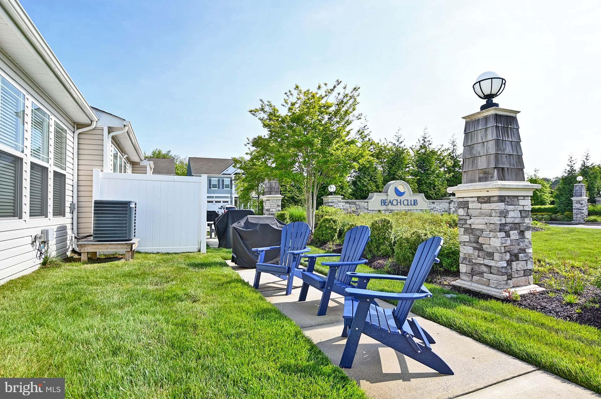 6 Basin Cove Way Ocean View, DE 19970 - Photo 6 of 45 a view of a chairs and table in backyard of the house