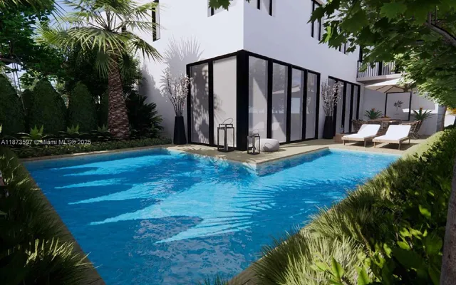 a view of a house with backyard and garden