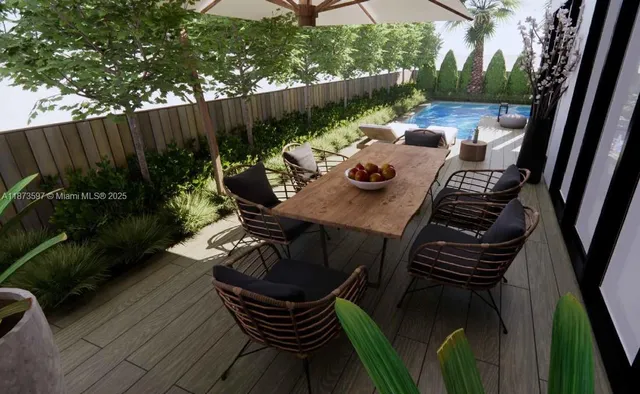 a view of a chairs and table in patio with wooden fence