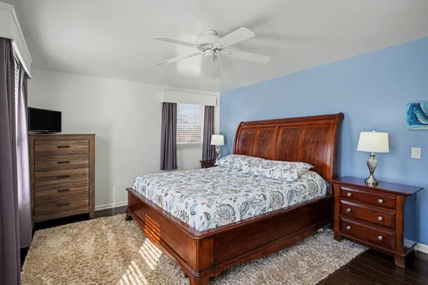 a bedroom with a bed and a dresser