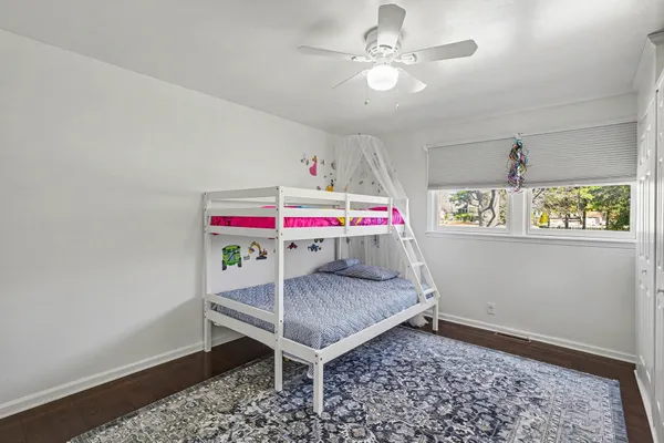 a room that has a bed and a table in it
