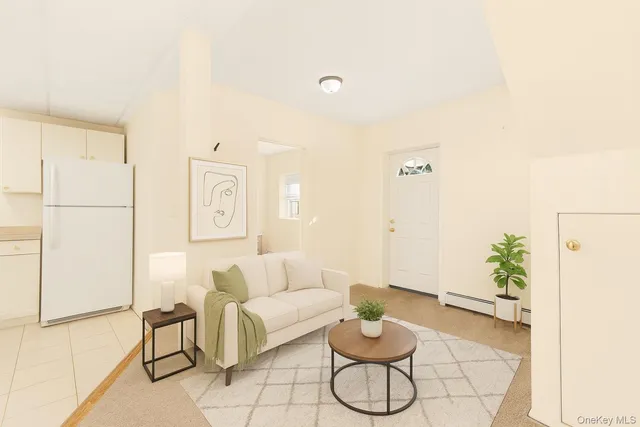 a living room with furniture and white walls