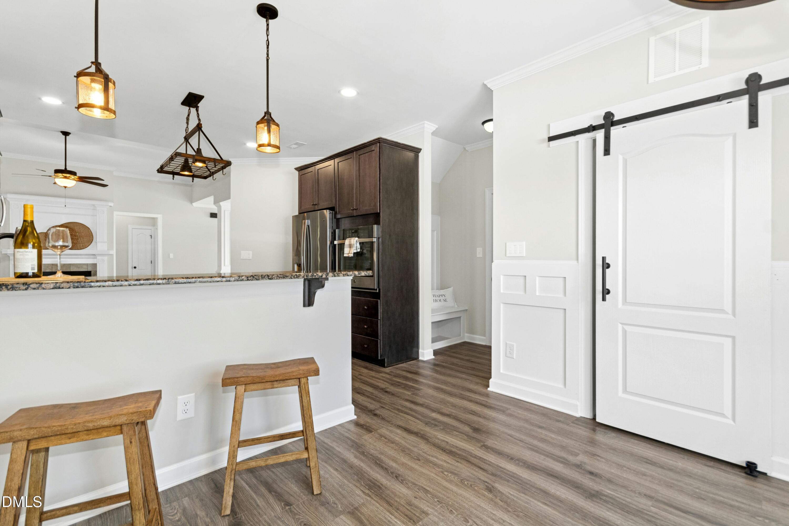 165 Thunder Ridge Drive Garner, NC 27529 - Photo 12 of 32 a room with wooden floor and windows