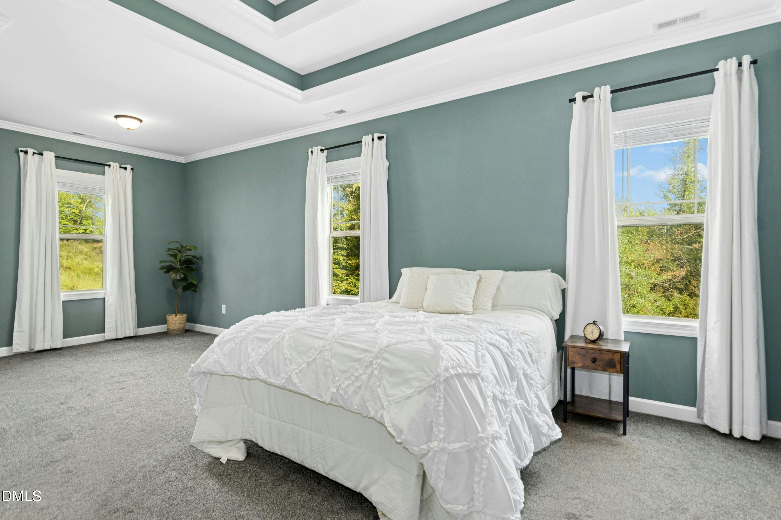 165 Thunder Ridge Drive Garner, NC 27529 - Photo 14 of 32 a bedroom with a bed and a window