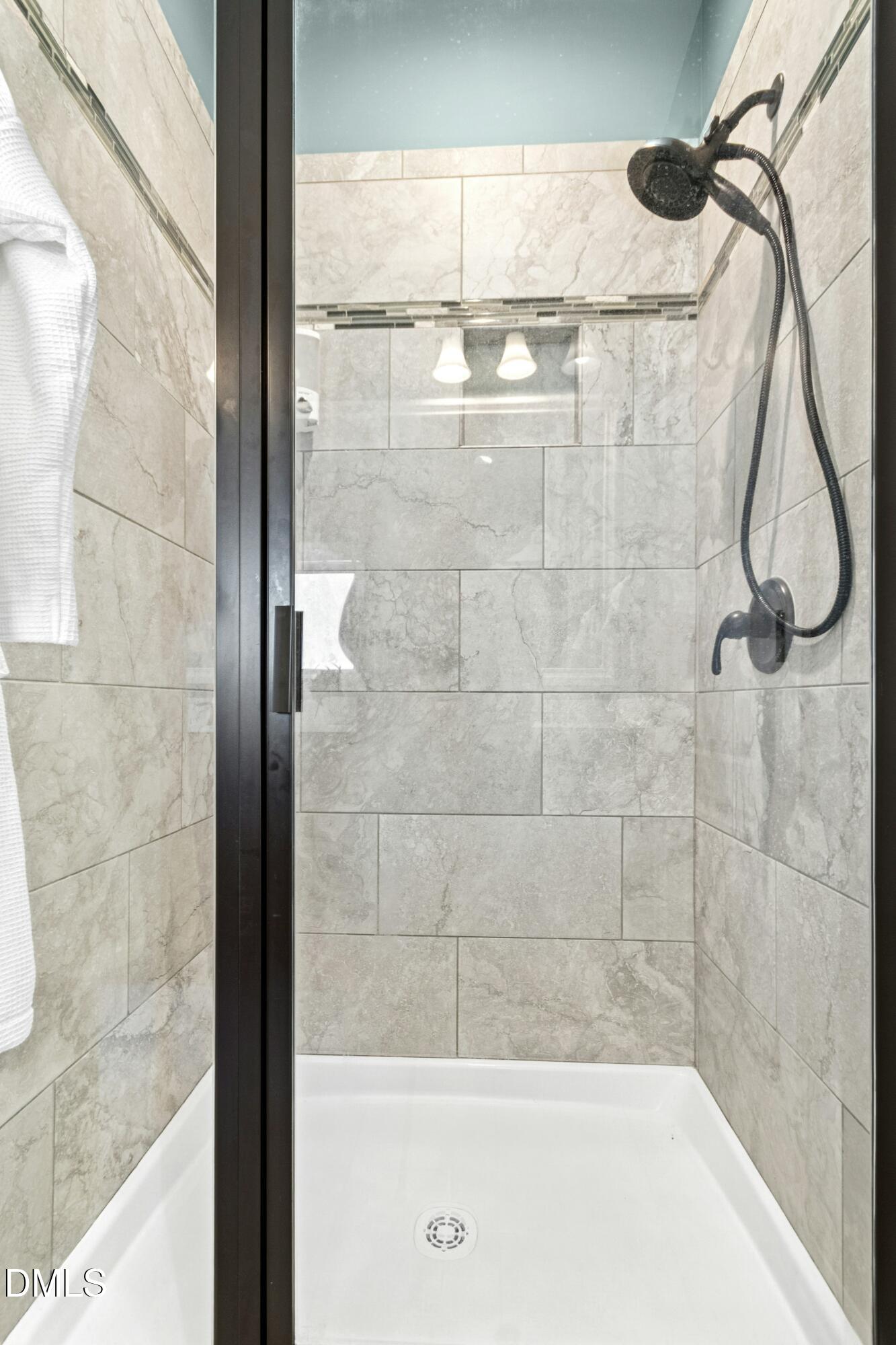 165 Thunder Ridge Drive Garner, NC 27529 - Photo 21 of 32 a bathroom with a shower