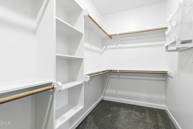 a view of an empty walk in closet