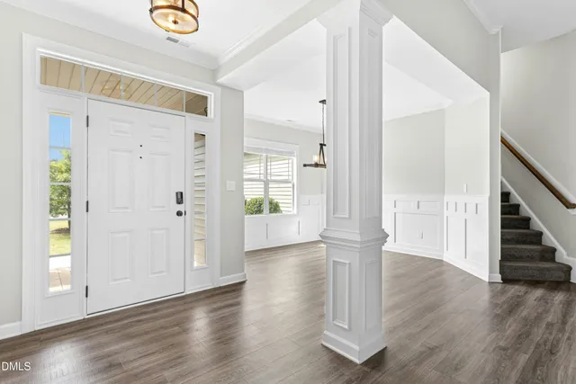 a view of entryway with wooden floor
