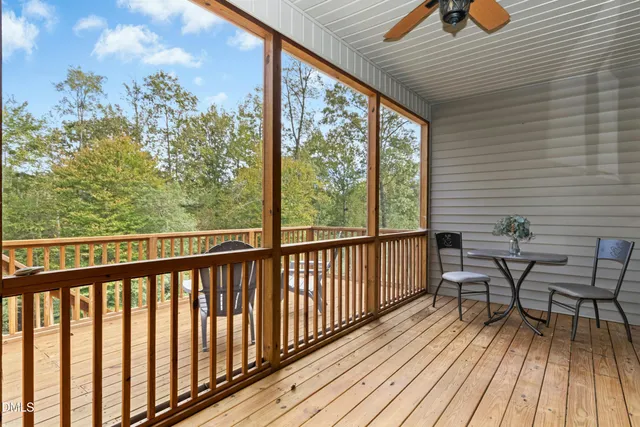 a view of a wooden deck with furniture
