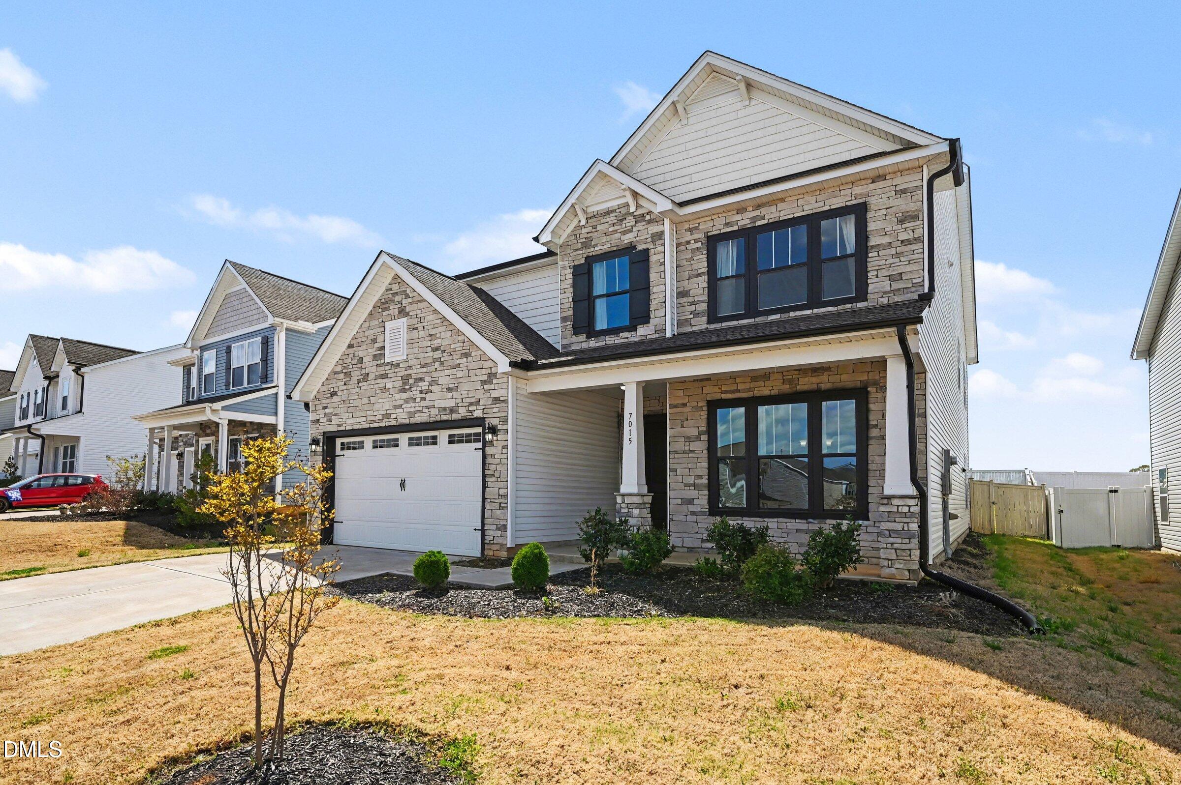 7015 Grainfield Road Mebane, NC 27302 - Photo 2 of 42 a front view of a house with a yard