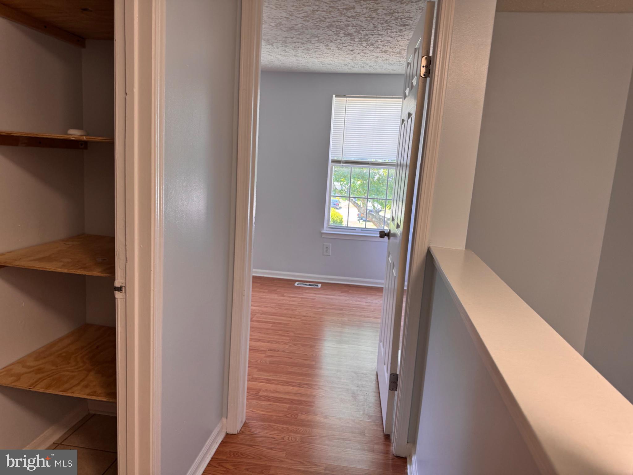 6917 Villa-Del-Rey Court Springfield, VA 22150 - Photo 13 of 26 Bright hallway leading to cozy room.