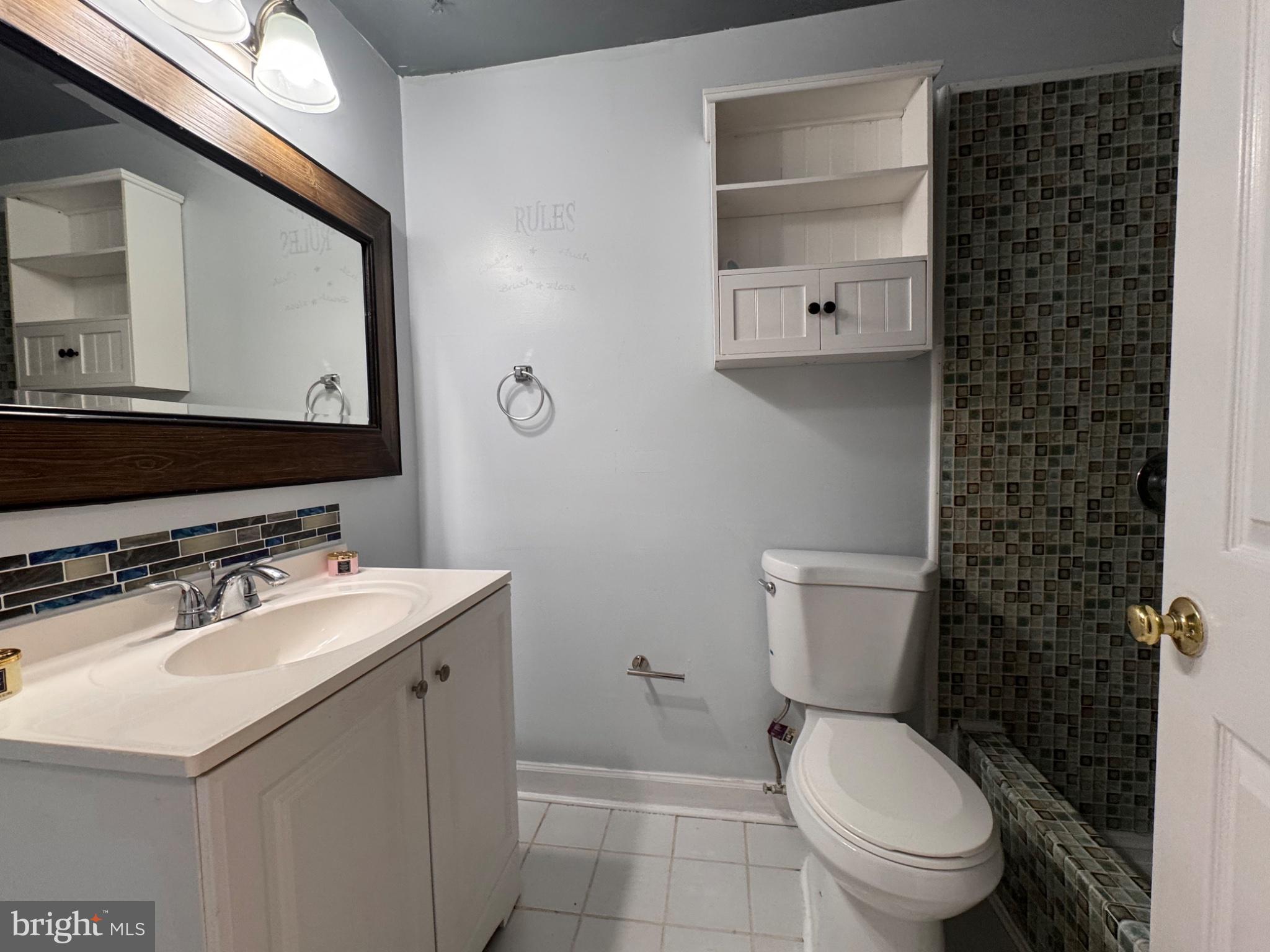 6917 Villa-Del-Rey Court Springfield, VA 22150 - Photo 14 of 26 Modern bathroom with stylish accents.