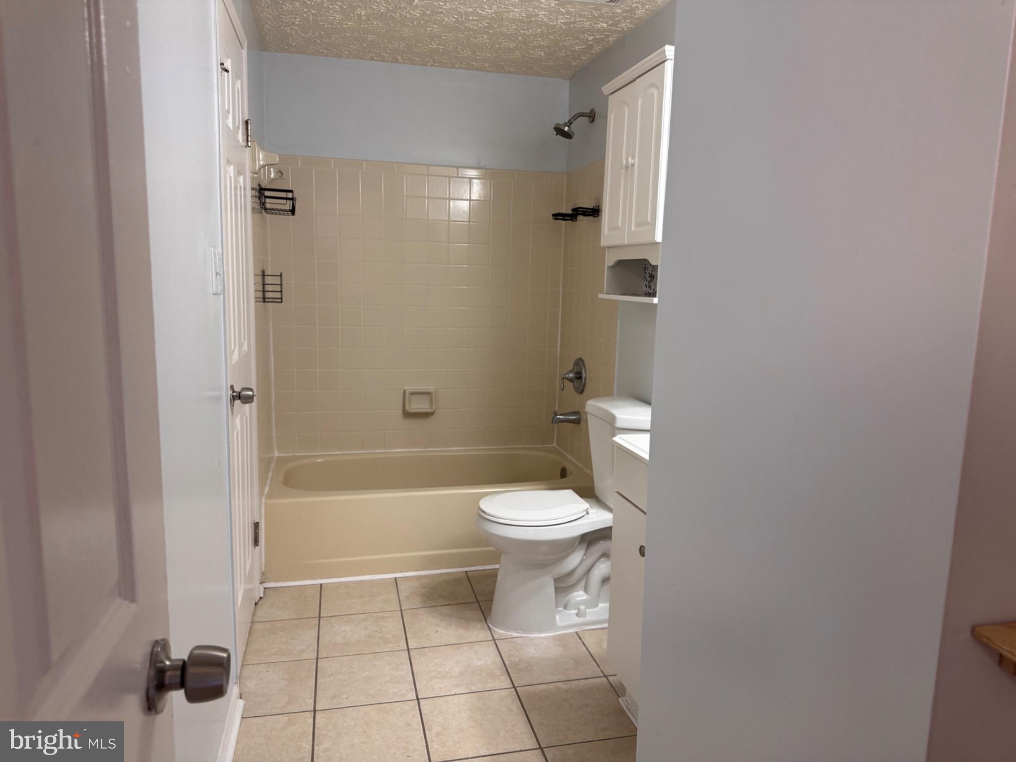 6917 Villa-Del-Rey Court Springfield, VA 22150 - Photo 17 of 26 Modern bathroom with neutral tones.