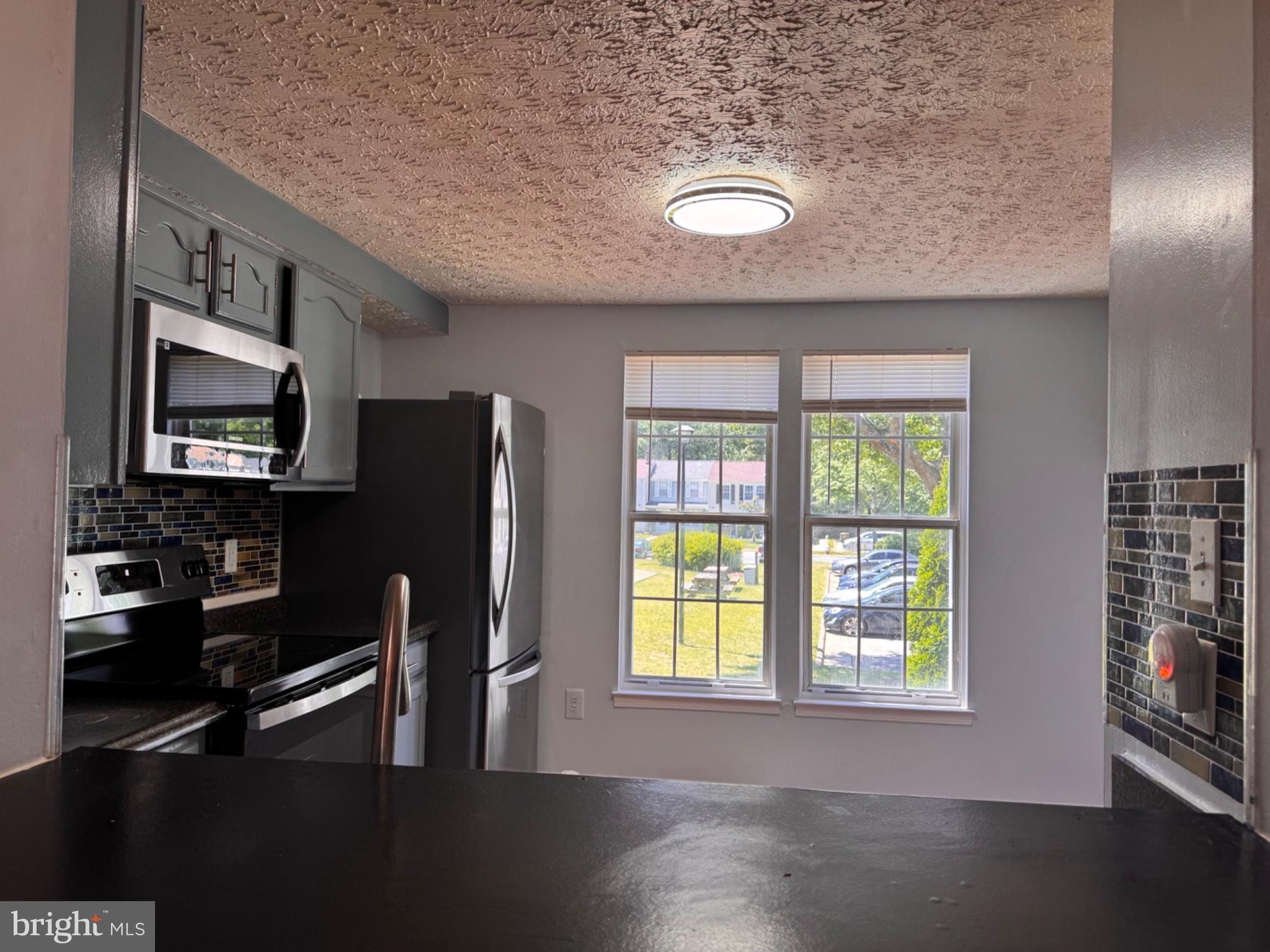 6917 Villa-Del-Rey Court Springfield, VA 22150 - Photo 4 of 26 Bright and inviting kitchen space.