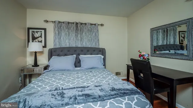 a bed room with a bed window and wall painting